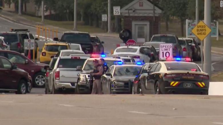 Law enforcement is seen stationed outside the Naval Air Station Pensacola on Friday, December 6, 2019.