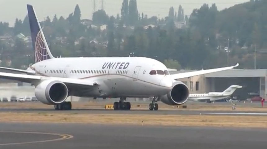 United Airlines plane landing.