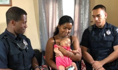 Officers Jerry Sonnal and Franklin Tejeda helped save Risibele Conceicao’s daughter Maddison.