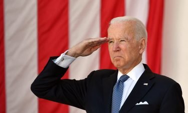 President Joe Biden salutes before delivering an address at the 153rd National Memorial Day Observance at Arlington National Cemetery on May 31.