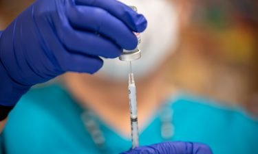 A nurse fills up a syringe with the Moderna Covid-19 vaccine at a vaccination site at a senior center on March 29 in San Antonio
