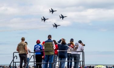 Spectators watch the U.S. Air Force Thunderbirds take to the sky during the Bethpage Air Show at Jones Beach in Wantagh