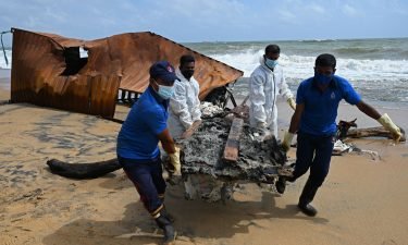 Members of Sri Lankan Navy remove debris washed ashore from the MV X-Press Pearl on a beach in Colombo on May 30.
