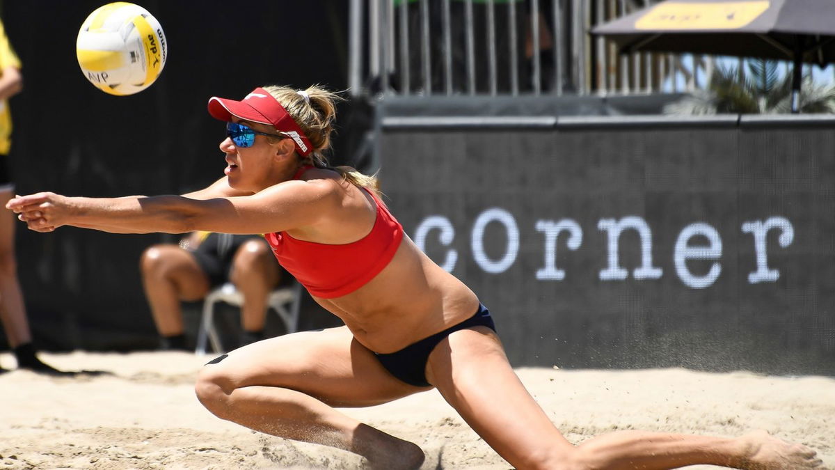 April Ross spikes a volleyball