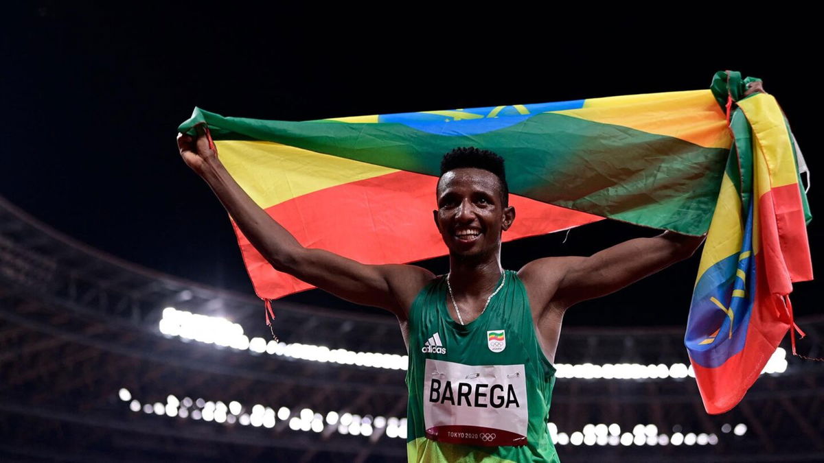 Ethiopia's Selemon Barega celebrates after winning the men's 10000m final during the Tokyo 2020 Olympic Games