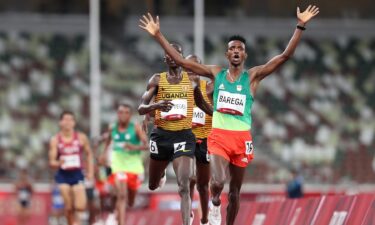 Selemon Barega of Team Ethiopia celebrates winning gold in the Men's 10