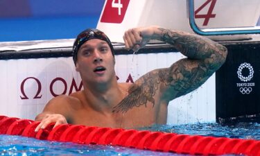 Caeleb Dressel flexes his Florida-themed left arm tattoo