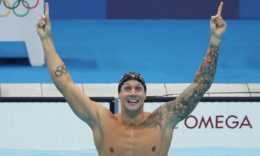 Caeleb Dressel celebrates a gold medal swim in the men's 100m freestyle at the Tokyo Olympics.