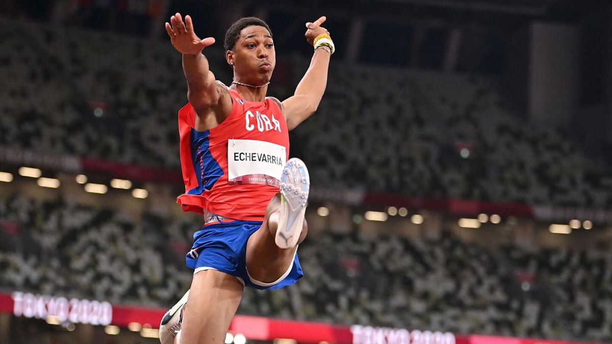 Cuba's Juan Miguel Echevarria competes in the men's long jump qualification during the Tokyo 2020 Olympic Games