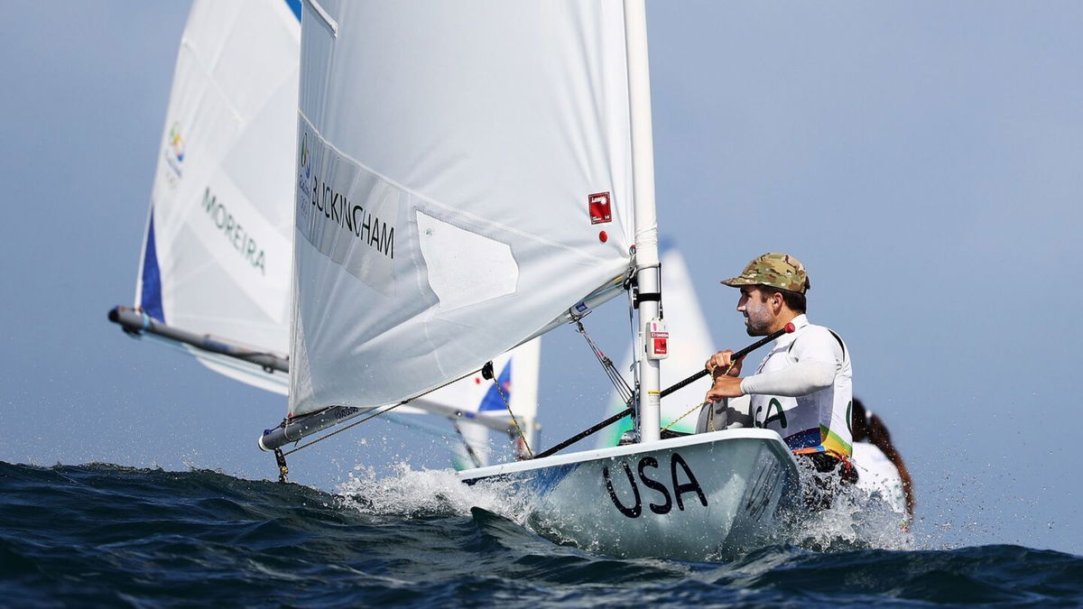 Charlie Buckingham of the United States waits to compete in the delayed Men's Laser class