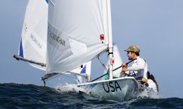 Charlie Buckingham of the United States waits to compete in the delayed Men's Laser class