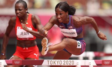 Mulern Jean of Team Haiti and Kendra Harrison of Team United States compete in round one of the Women's 100m hurdles heats on day eight of the Tokyo 2020 Olympic Games