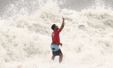 Italo Ferreira celebrates surfing victory