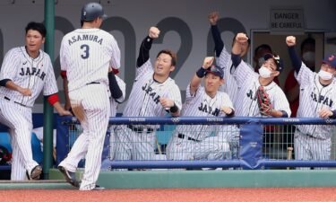 Japan celebrates a 3-2 walk-off victory against the Dominican Republic in the opening game of the Tokyo Olympics baseball tournament.