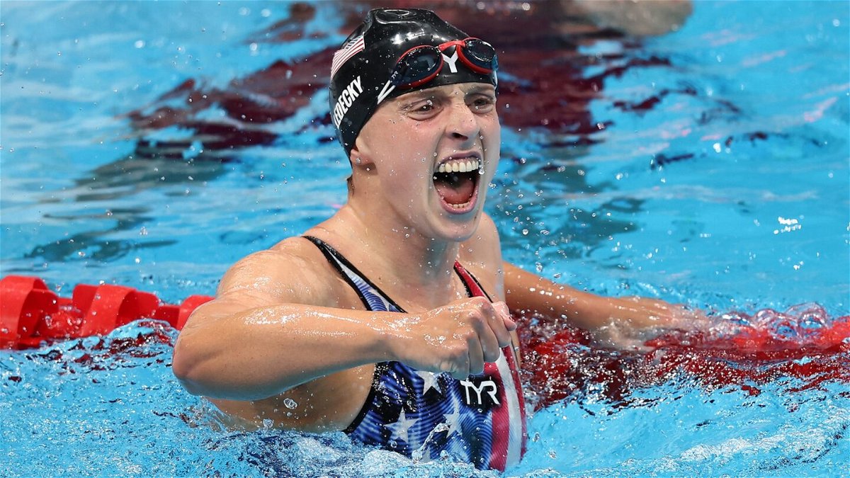 Katie Ledecky of the United States celebrates after winning the gold medal in the women's 1500m freestyle on day five of the Tokyo Olympic Games.