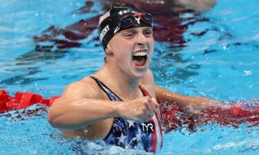 Katie Ledecky of the United States celebrates after winning the gold medal in the women's 1500m freestyle on day five of the Tokyo Olympic Games.