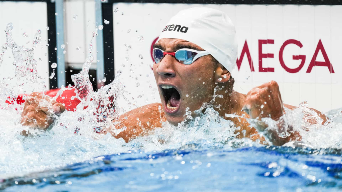 Ahmed Hafnaoui celebrates after winning the men's 400m freestyle