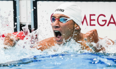 Ahmed Hafnaoui celebrates after winning the men's 400m freestyle