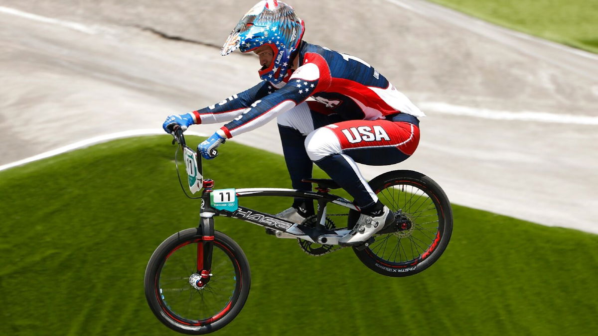 France's Andre wins third BMX QF run