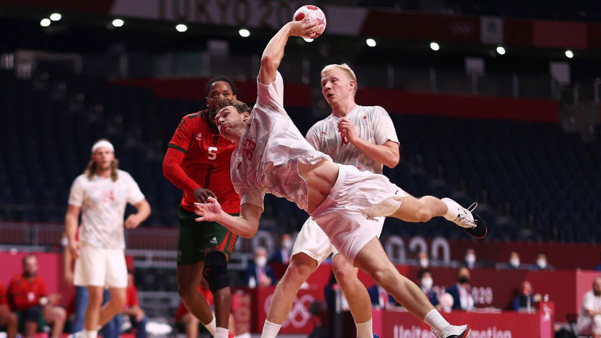 A denmark handball player throwing the ball