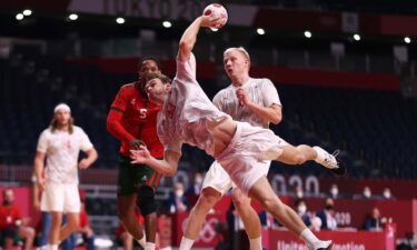 A denmark handball player throwing the ball