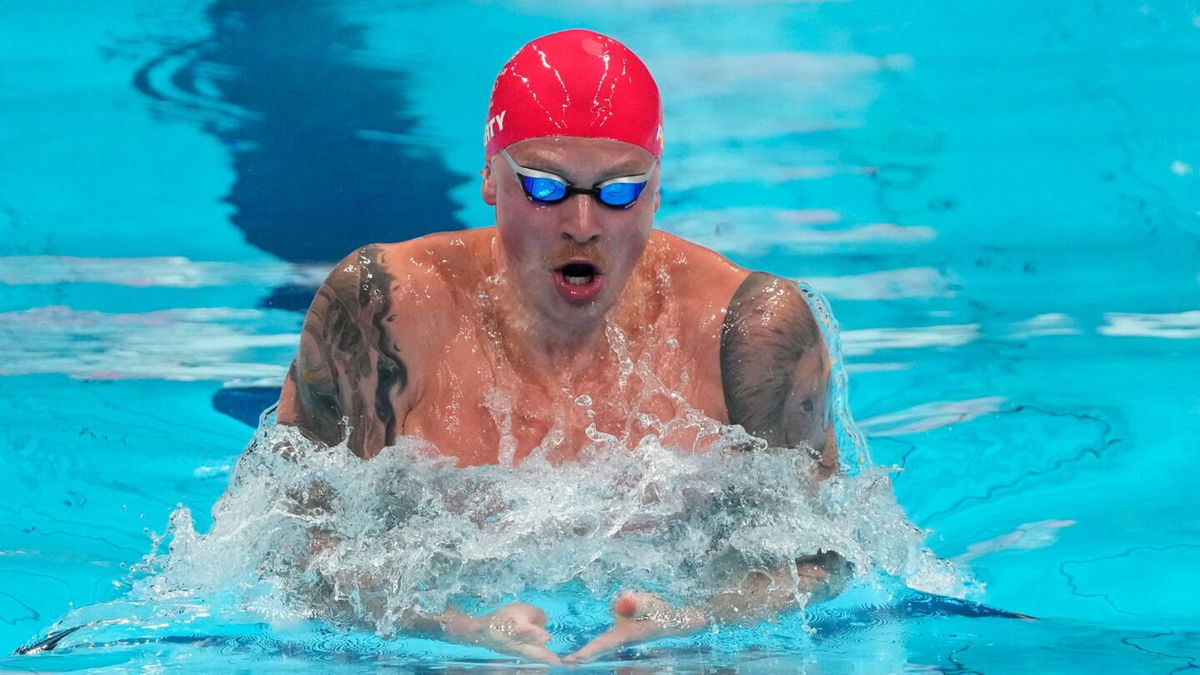 Adam Peaty competes in the 100m breaststroke