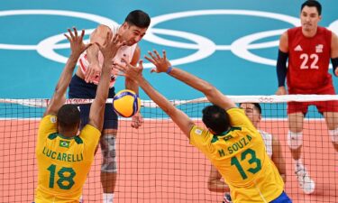 Taylor Sander spikes the ball vs. Brazil