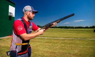 Vincent Hancock poses with a shotgun