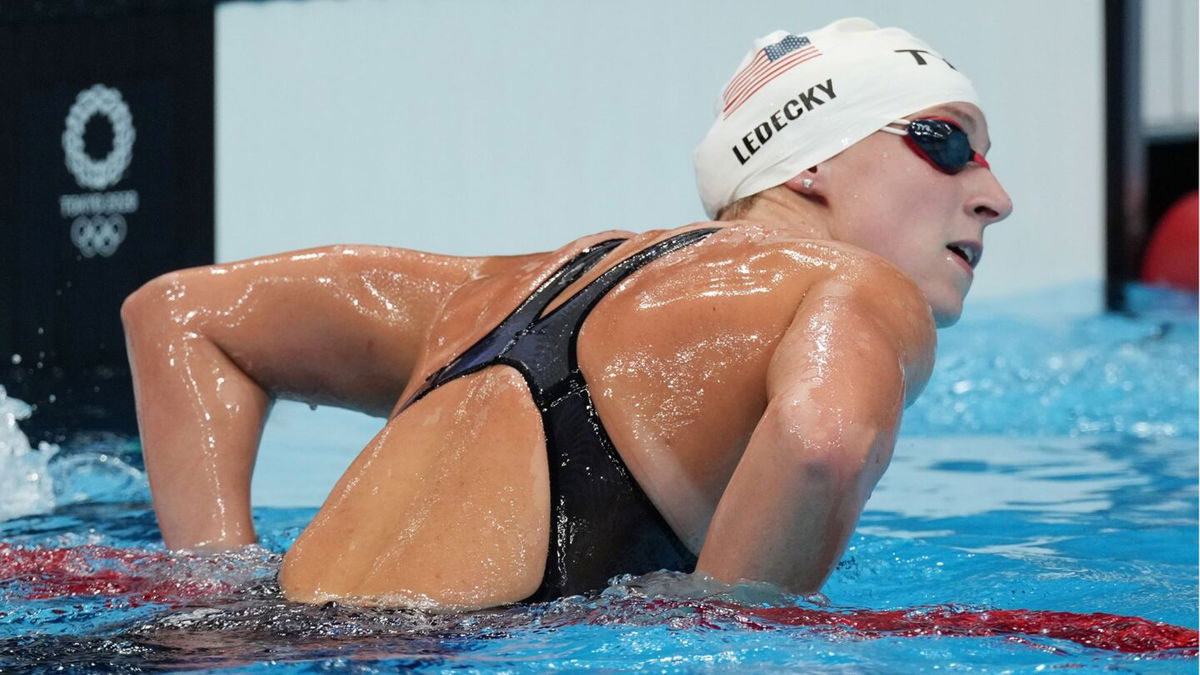 Katie Ledecky looks at the clock