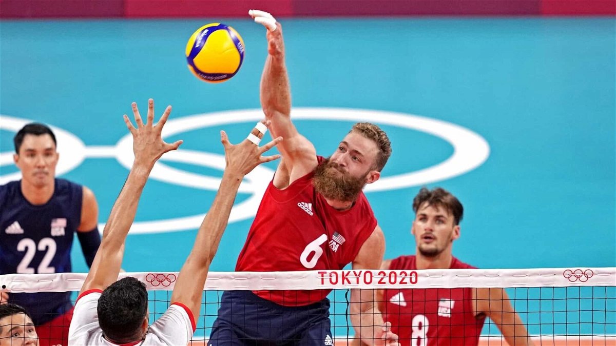 U.S. middle blocker Mitchell Stahl skies for a kill Wednesday against Tunisia at the Tokyo Olympics.