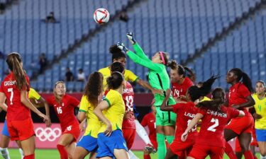 Stephanie Labbe of Canada punches the ball during the Women's Olympic quarterfinal match between Canada and Brazil