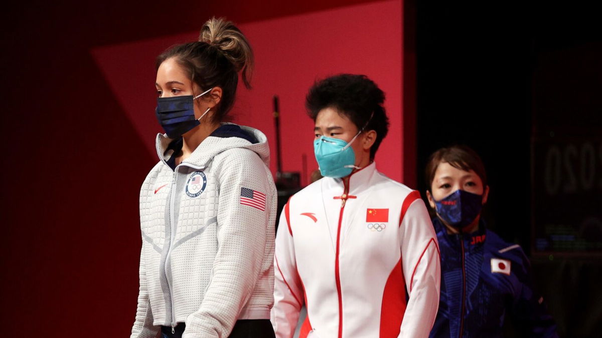 Jourdan Delacruz and Hou Zhihui walk toward the stage