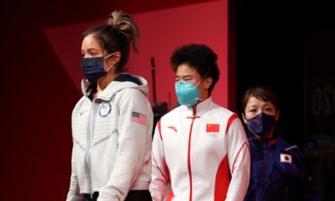 Jourdan Delacruz and Hou Zhihui walk toward the stage