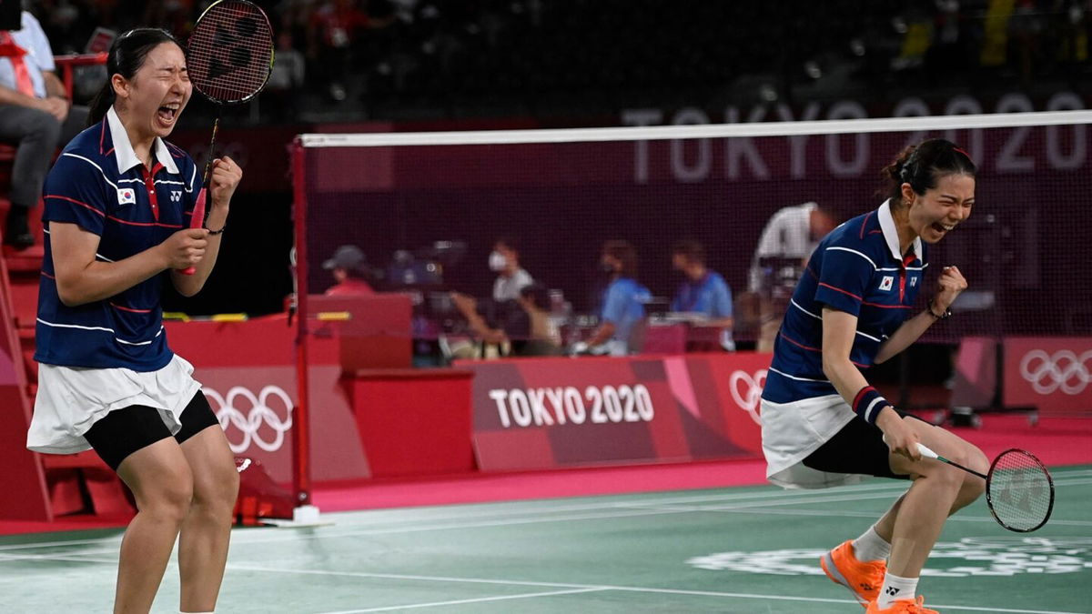 South Korea's Kong Hee-yong and Kim So-yeong celebrate after winning their women's doubles badminton quarterfinal match against Japan.