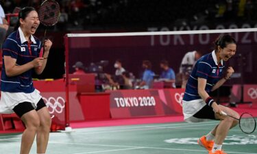 South Korea's Kong Hee-yong and Kim So-yeong celebrate after winning their women's doubles badminton quarterfinal match against Japan.