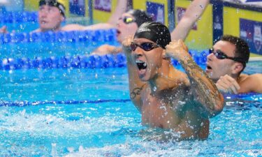 Caeleb Dressel celebrates in the water