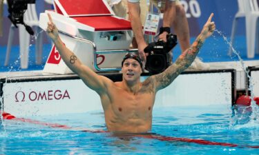 Caeleb Dressel celebrates in the water