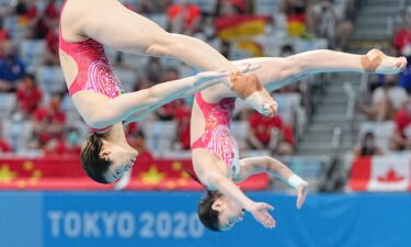 Wang Han and Shi Tingmao perform a dive as part of their gold medal winning sychro springboard list.