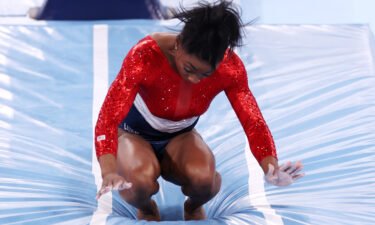 Simone Biles of Team United States stumbles upon landing after competing in vault during the women's team final on day four of the Tokyo 2020 Olympic Games at Ariake Gymnastics Centre.