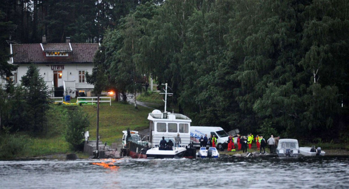 <i>Vegard M. Aas/presse30.no/Getty Images</i><br/>Police and emergency services gather following the massacre at a summer youth camp on July 22