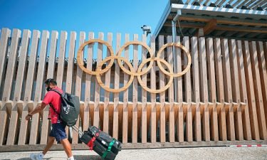 The entrance to the Olympic Village is shown at Tokyo 2020. A Tokyo public health expert says the Olympic bubble system "is kind of broken" just three days before the sporting spectacle is set to begin.