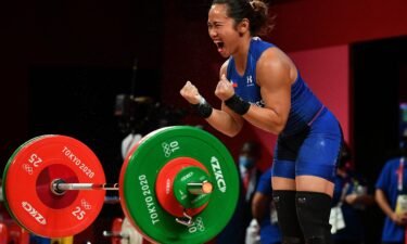 Philippines' Hidilyn Diaz reacts while competing in the women's 55kg weightlifting competition during the Tokyo 2020 Olympic Games.