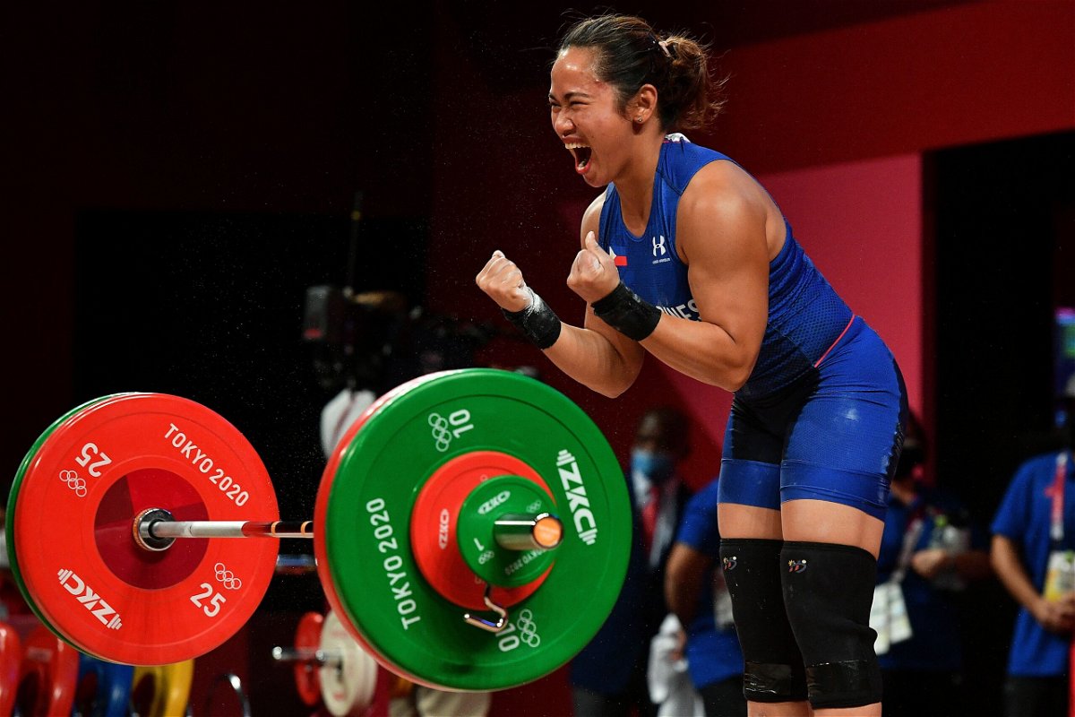 <i>Vincenzo Pinto/AFP/Getty Images</i><br/>Philippines' Hidilyn Diaz reacts while competing in the women's 55kg weightlifting competition during the Tokyo 2020 Olympic Games.