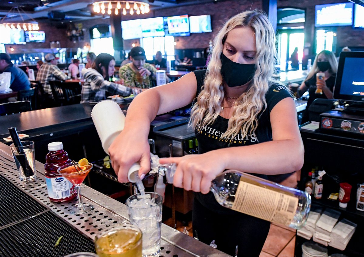 <i>Ben Hasty/MediaNews Group/Reading Eagle/Getty Images</i><br/>Bartender Olivia Imes prepares a drink for a customer at P.J. Whelihan's restaurant and pub in Spring Township