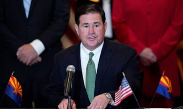 Arizona Gov. Doug Ducey's education adviser sent a letter to two school districts stating a mandatory quarantine practice is contrary to state law.