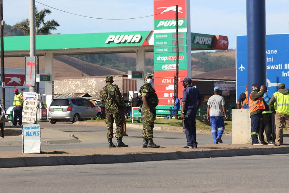<i>AFP/Getty Images</i><br/>eSwatini soldiers and police officers are seen on the streets near the Oshoek Border Post between Eswatini and South Africa on July 1.