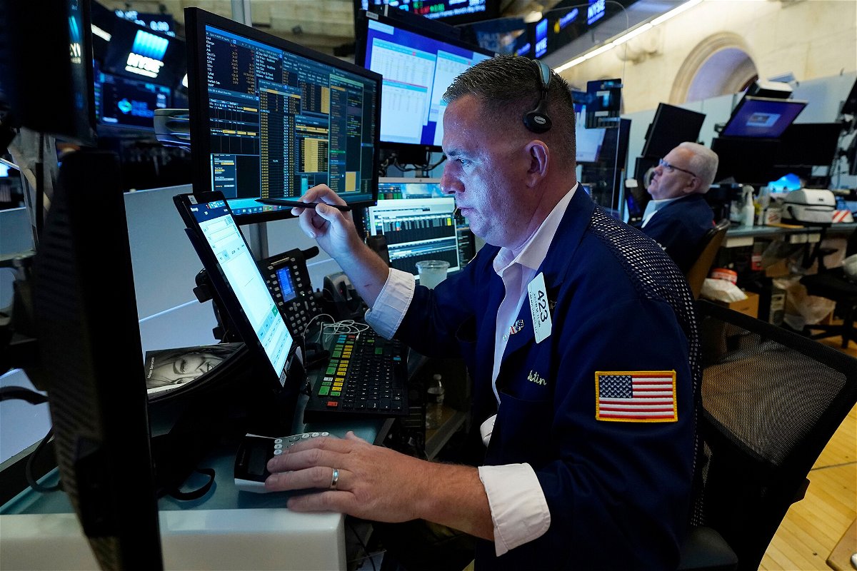 <i>Richard Drew/AP</i><br/>Trader Justin Flinn works on the floor of the New York Stock Exchange