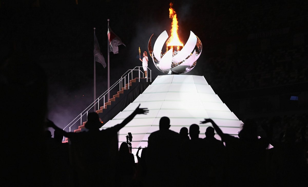 <i>Matthias Hangst/Getty Images</i><br/>Naomi Osaka of Team Japan lights the Olympic cauldron with the Olympic torch during the opening ceremony of the Tokyo 2020 Olympic Games on Friday