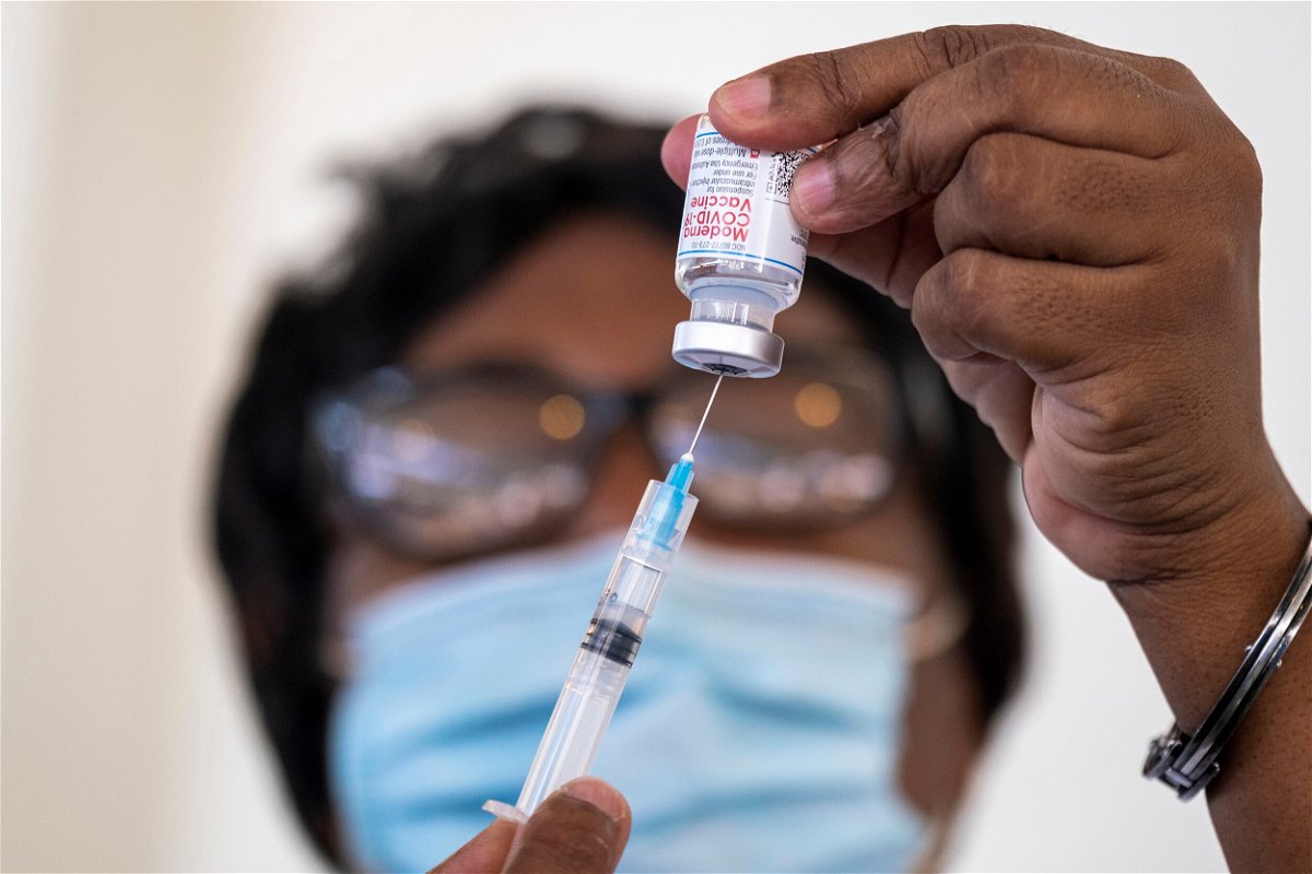 <i>Ricardo Arduengo/Reuters</i><br/>A health worker prepares a dose of the Moderna Covid-19 vaccine at the Saint Damien Hospital in Port-au-Prince
