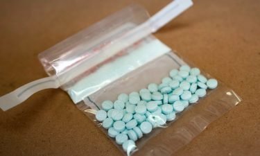 Tablets believed to be laced with fentanyl are displayed at the Drug Enforcement Administration Northeast Regional Laboratory on October 8